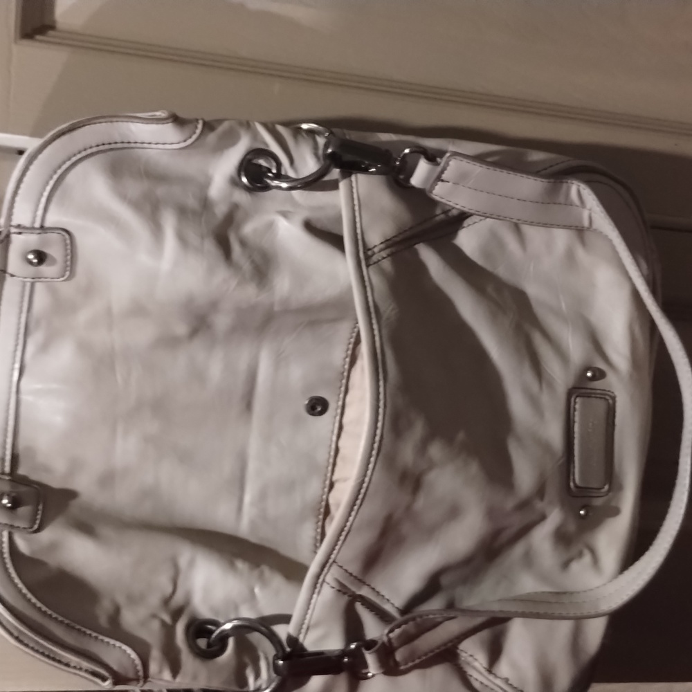 Nice shoulder bag as you see there's a tear where zipper is little not to notica